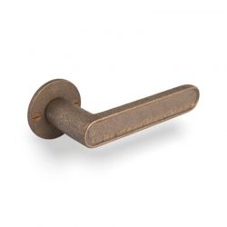 Poignée de porte CAST sur rosace ronde 50F bronze brut Dauby