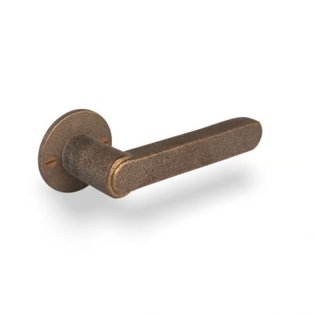 Poignée de porte TUKAN sur rosace ronde 50F bronze brut Dauby