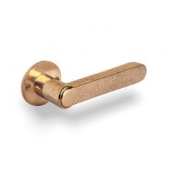 Poignée de porte TUKAN sur rosace ronde 50F bronze brut poli Dauby